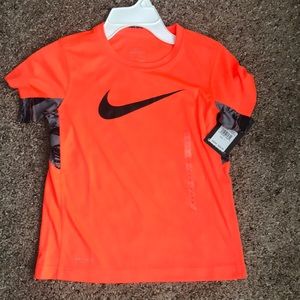 Kids orange Nike shirt
